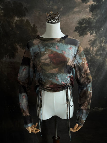 A Historical Renaissance Painting Printed Sheer Mesh Long-Sleeve Ruched Blouse on a mannequin in front of an art history backdrop