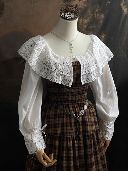 A styled outfit using a brown plaid maxi dress and a Baroque to Victorian era historically inspired white cotton chemise dress with large crochet lace collar and bishop sleeves