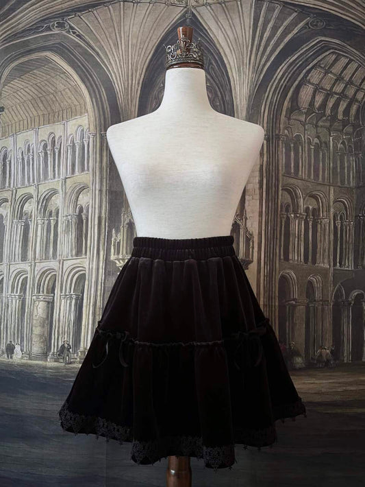 A Historically Inspired Renaissance and Medieval Style Gothic Lace-Trimmed Velvet Mini Skirt in Black with Bow appliques.