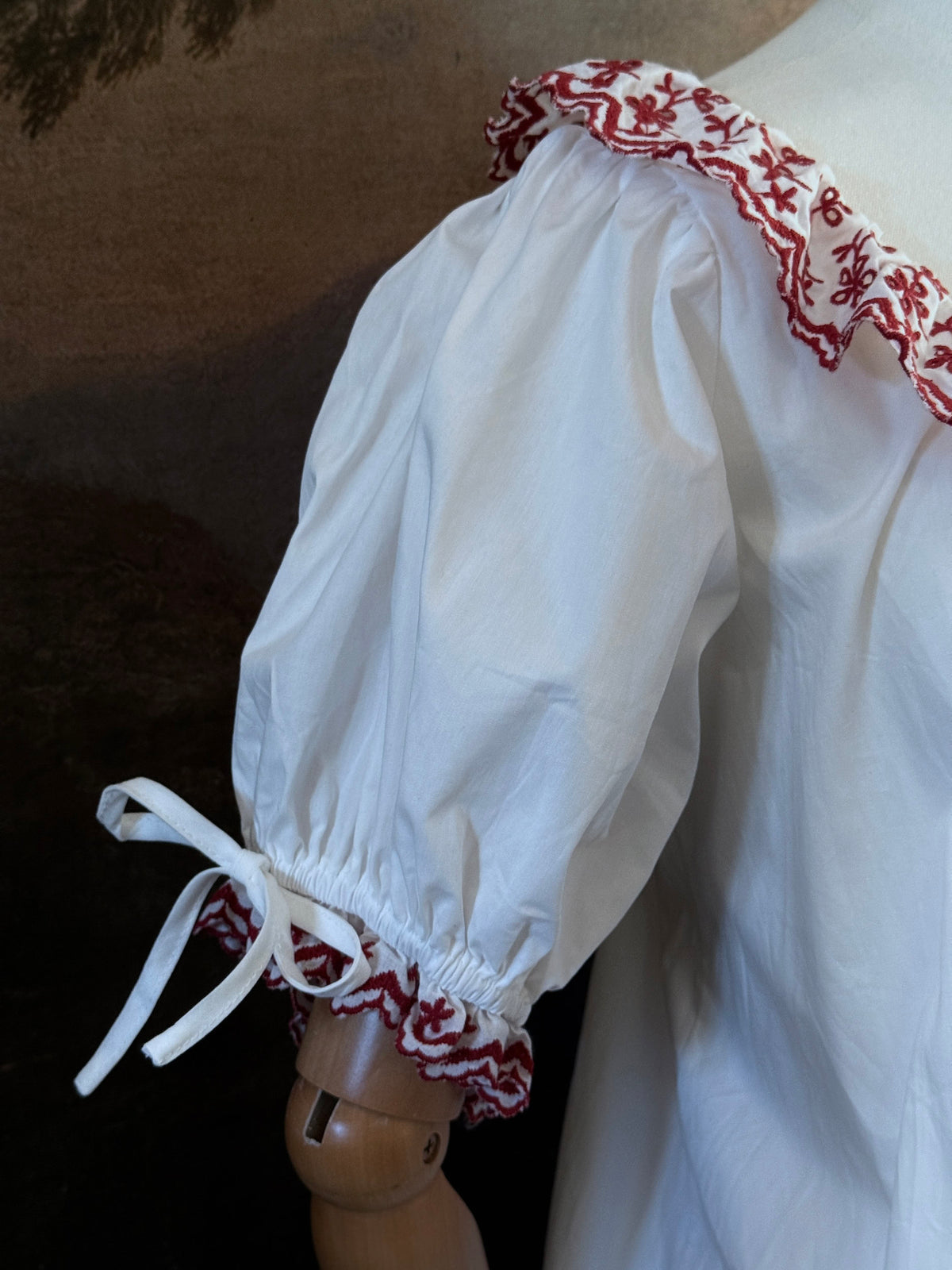 Close up of the red embroidery on sleeve