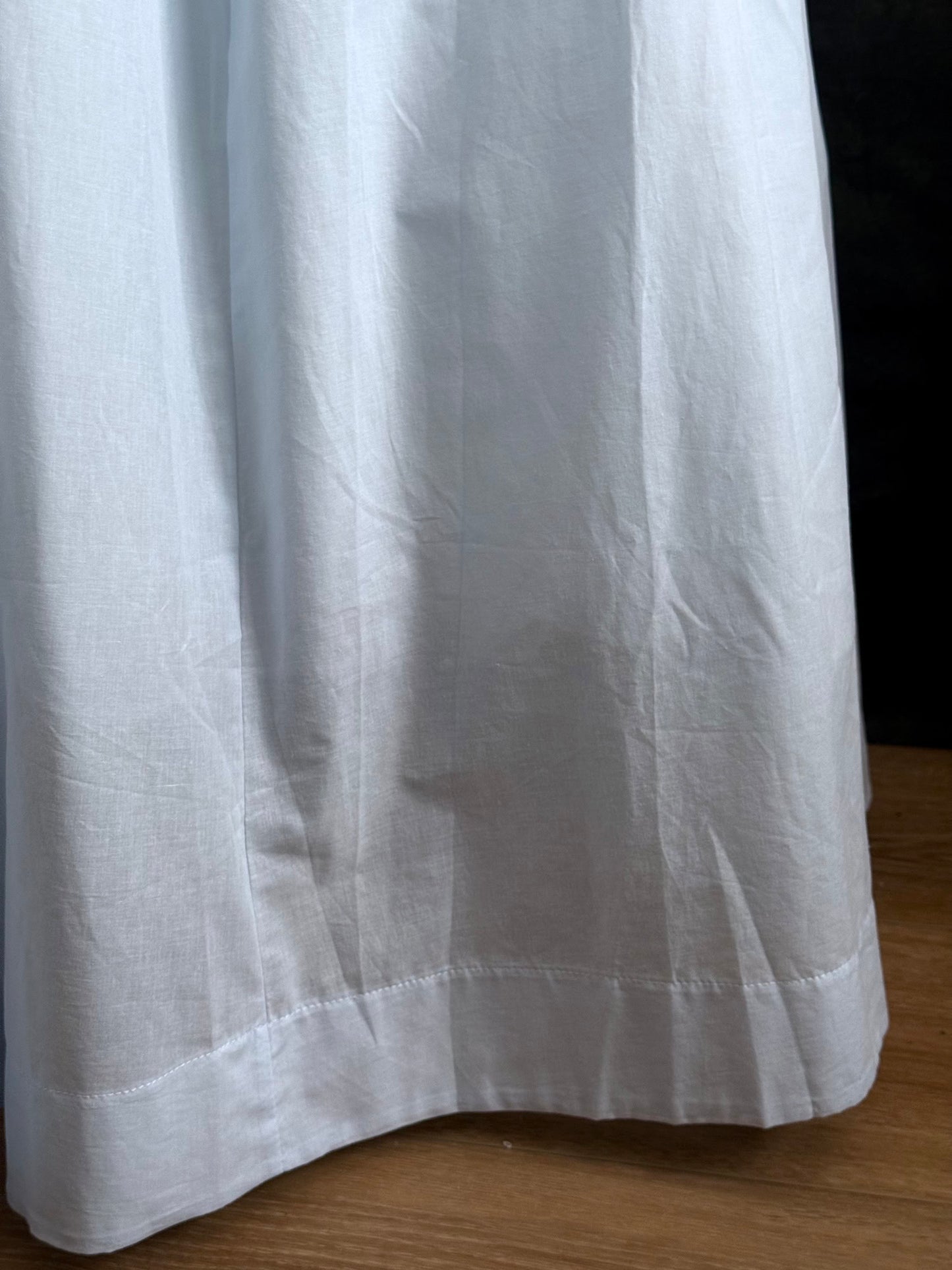 A historically-inspired vintage style light blue shirred / smocked cotton maxi chemise dress with half length virago puff sleeves, pictured on a mannequin