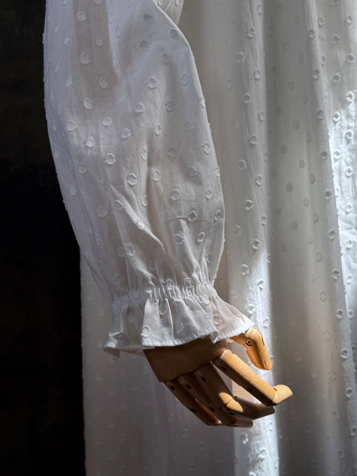 Close up of ruffle hem sleeve