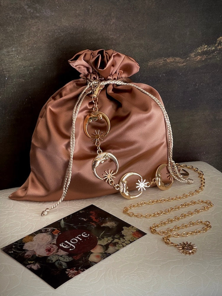 A historically inspired accessories mystery bag pictured on a stool with a historical background 