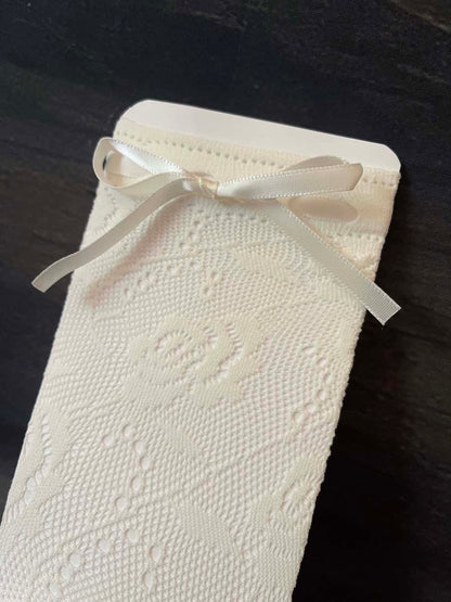 A Pair of historically inspired vintage style floral lace socks with satin ribbon bowtie. Edwardian, victorian, regency, rococo era.