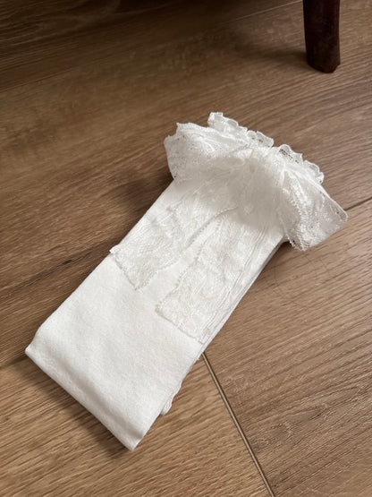 Historically inspired off-white cotton stockings with lace trim and bow ribbons for medieval, renaissance, tudor, baroque, rococo, regency, victorian, and edwardian outfits.