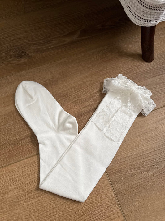 Historically inspired off-white cotton stockings with lace trim and bow ribbons for medieval, renaissance, tudor, baroque, rococo, regency, victorian, and edwardian outfits.