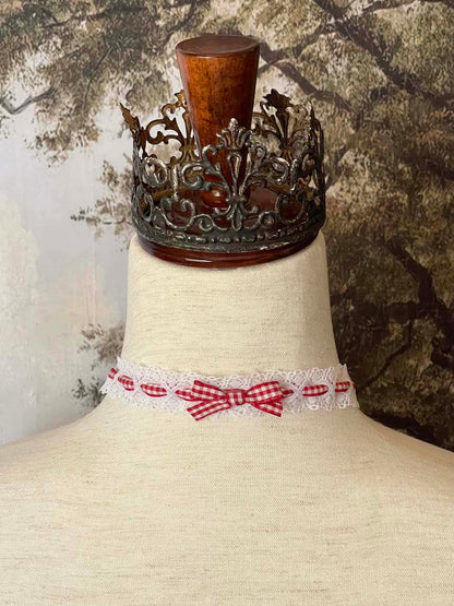 A Vintage style historically inspired cotton lace and gingham ribbon bow choker necklace in white and red.