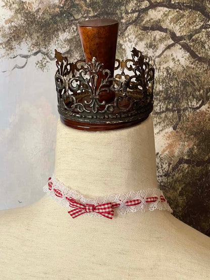 A Vintage style historically inspired cotton lace and gingham ribbon bow choker necklace in white and red.