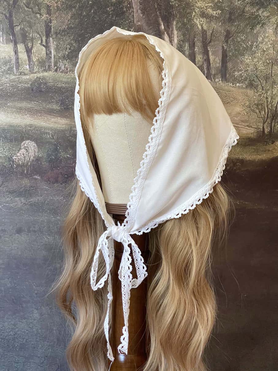 Historically inspired cottagecore coquette victorian babushka style triangle headscarf hair accessory with lace trim and bow accessories. 