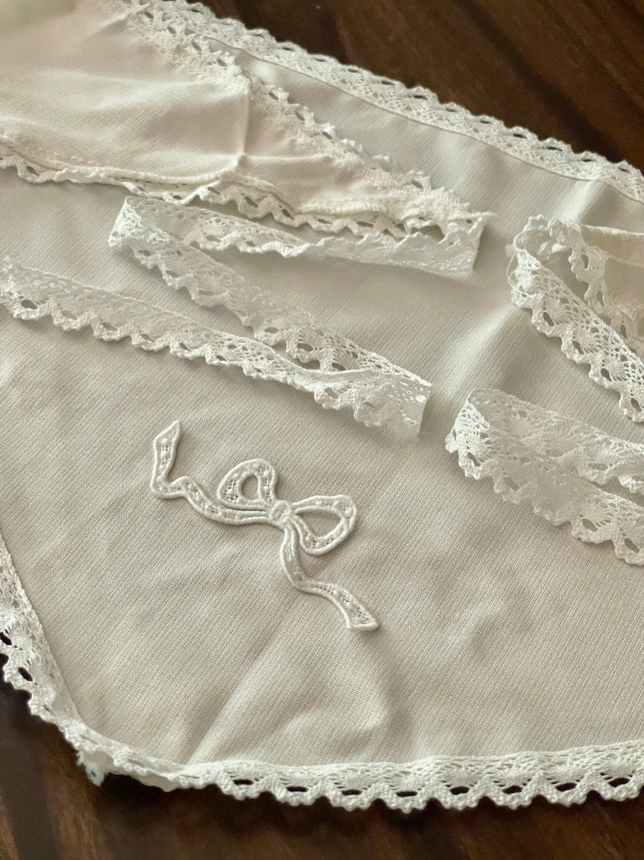 Historically inspired cottagecore coquette victorian babushka style triangle headscarf hair accessory with lace trim and bow accessories. 