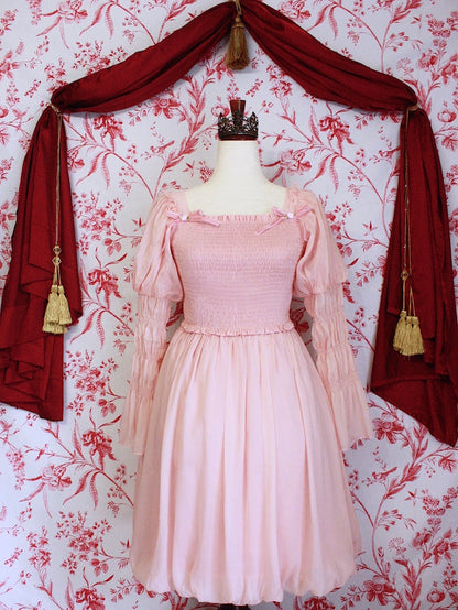 A Historically Inspired Victorian, Regency, Rococo, or Renaissance Style Virago Sleeve Mini Dress with Bow Appliques and Bubble Hem Skirt in Ballerina Pink.
