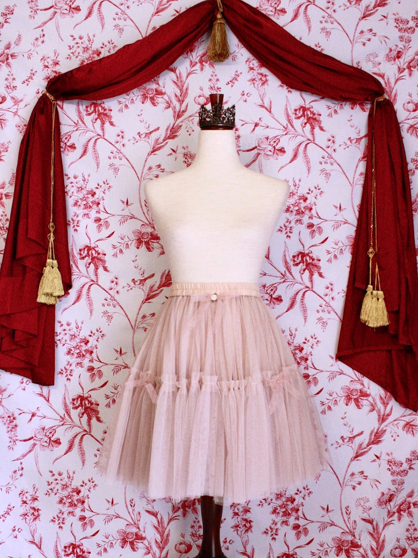 Historically Inspired Victorian Style Frilly Tiered Ballet Skirt with Bow Appliques and Rosette embellishment in Nude-Pink.