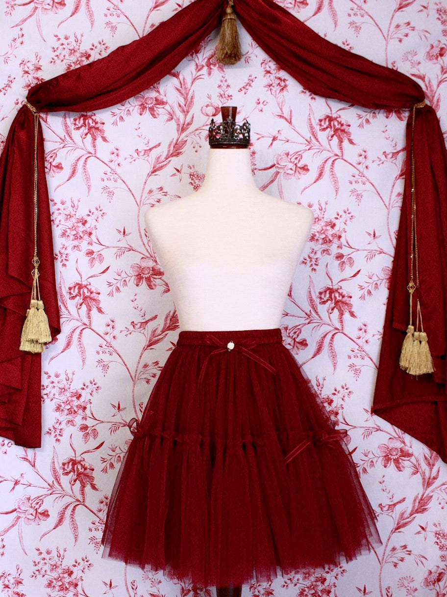 A Historically Inspired Victorian Style Frilly Tiered Ballet tutu Skirt with Bow Appliques and Rosette Embellishentin Burgundy.
