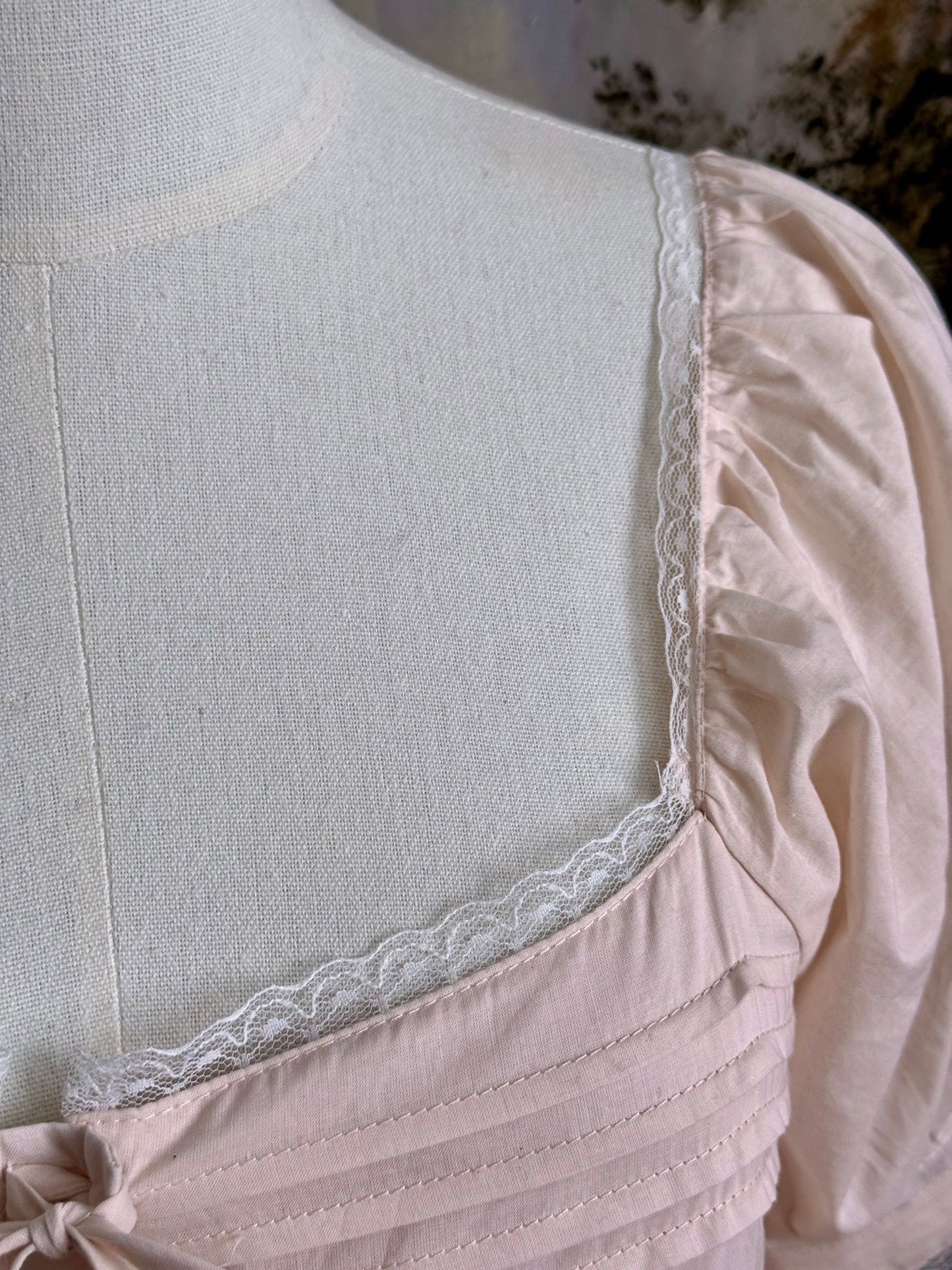 Close-up of the vintage-style dress's lace trim.