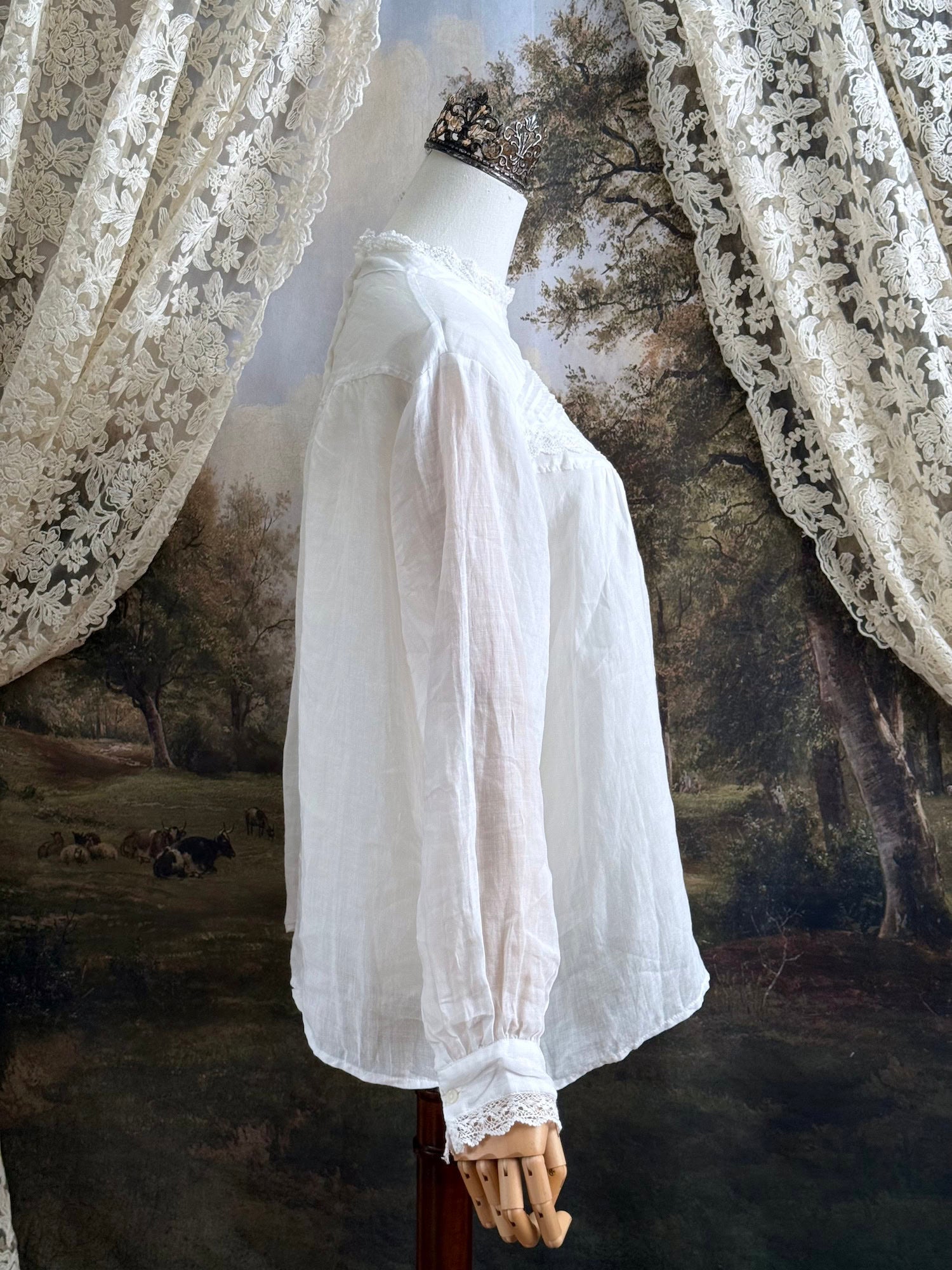 White linen Victorian/ Edwardian-Inspired High Neck Pintuck Lace-Trimmed Blouse pictured on a mannequin.