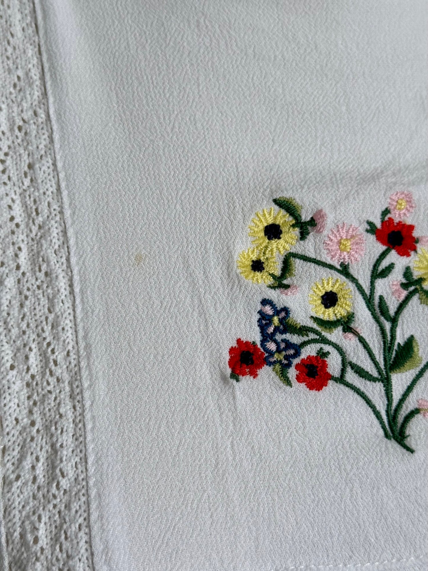 Close up stain and embroidered flowers