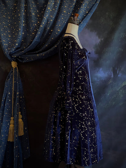 A Renaissance and Medieval Fantasy Inspired Celestial Star Velvet Bishop Sleeve Midi Dress with Satin Ribbon Neck Ties and a structured witchy whimsigoth silhouette.