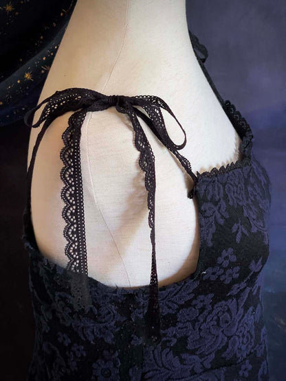 An Upcycled Ornate Damask Fabric Structured Peplum Top with Lace Trim in Black and Navy Blue.