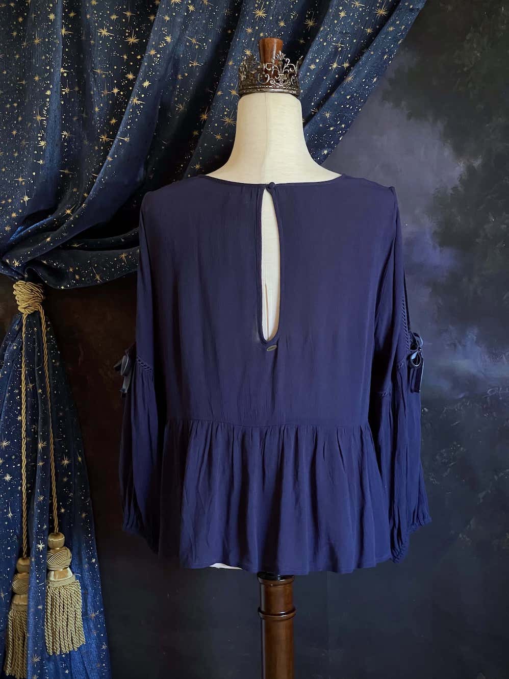 A Flowy Cold-Shoulder Historically Inspired Peasant Blouse with Velvet Ribbons in Navy Blue