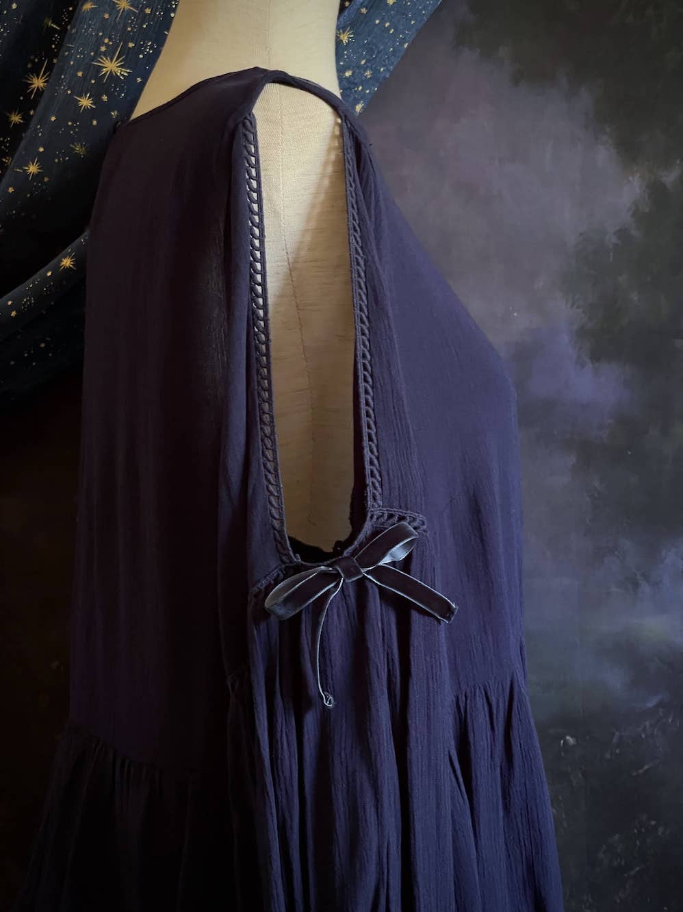 A Flowy Cold-Shoulder Historically Inspired Peasant Blouse with Velvet Ribbons in Navy Blue