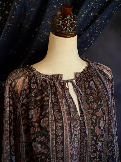 A Historically Inspired Botanical Print Peasant Blouse with Gathered Waist and Bell Tulip Bishop Sleeves in Black, Purple, Blue.