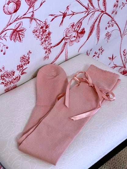 A pair of historically inspired knee high stocking socks in ballerina pink, for edwardian, victorian, regency, rococo, baroque, renaissance, and medieval era fashion.