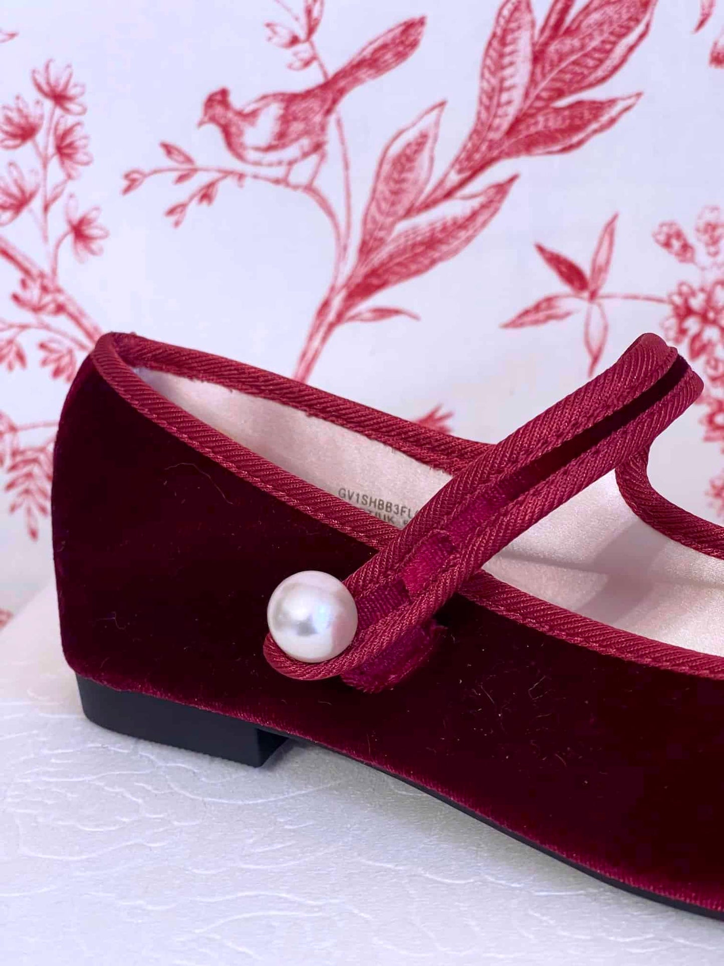 A pair of Historically Inspired Renaissance, Tudor, Baroque era Velvet Slipper Flats in Burgundy with pearl decorative button.