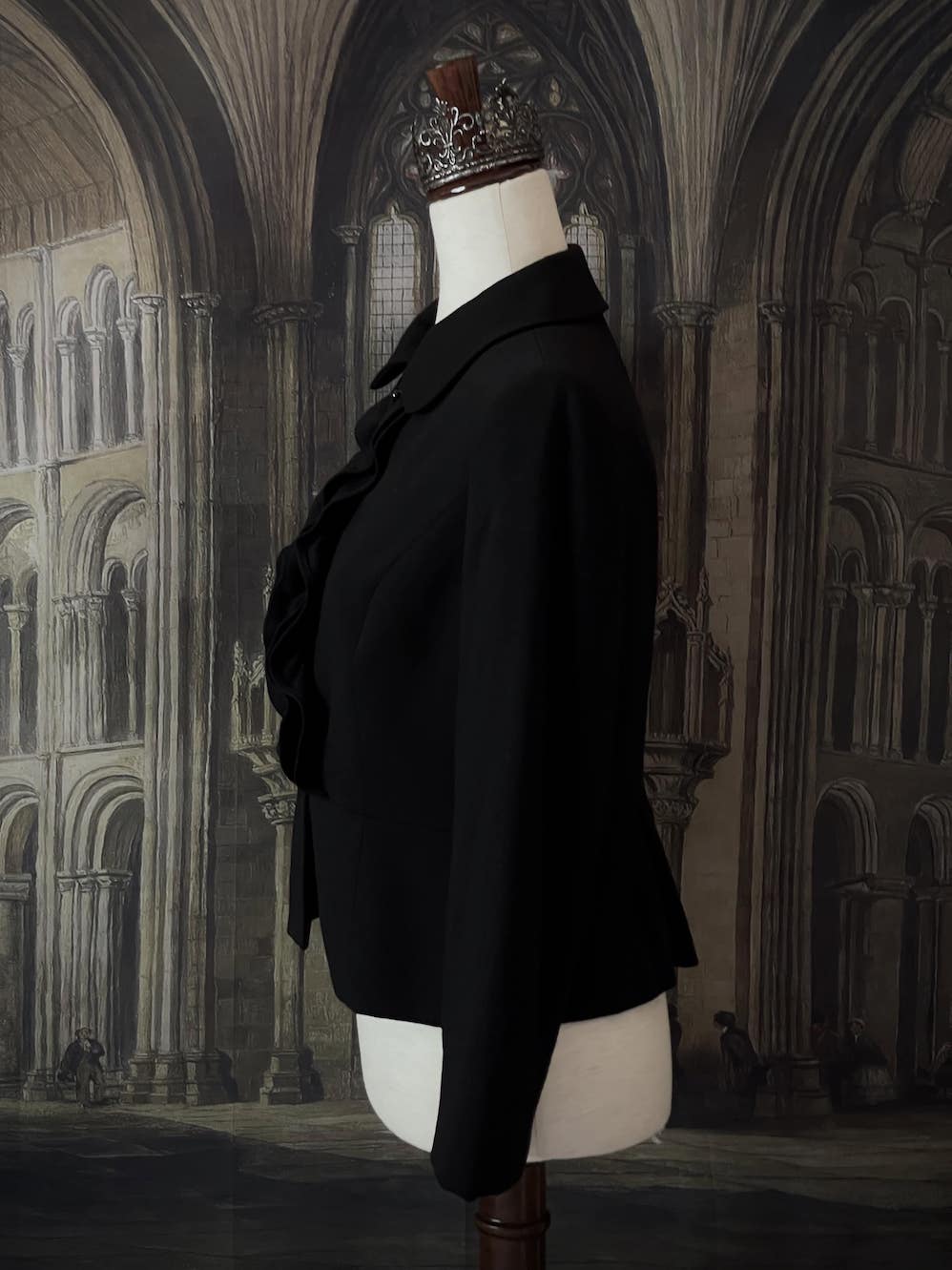 Historically inspired Victorian-inspired tailored ruffle jabot jacket coat with button front.