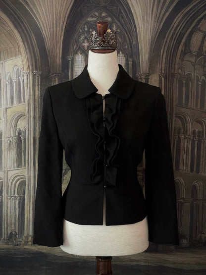 Historically inspired Victorian-inspired tailored ruffle jabot jacket coat with button front.